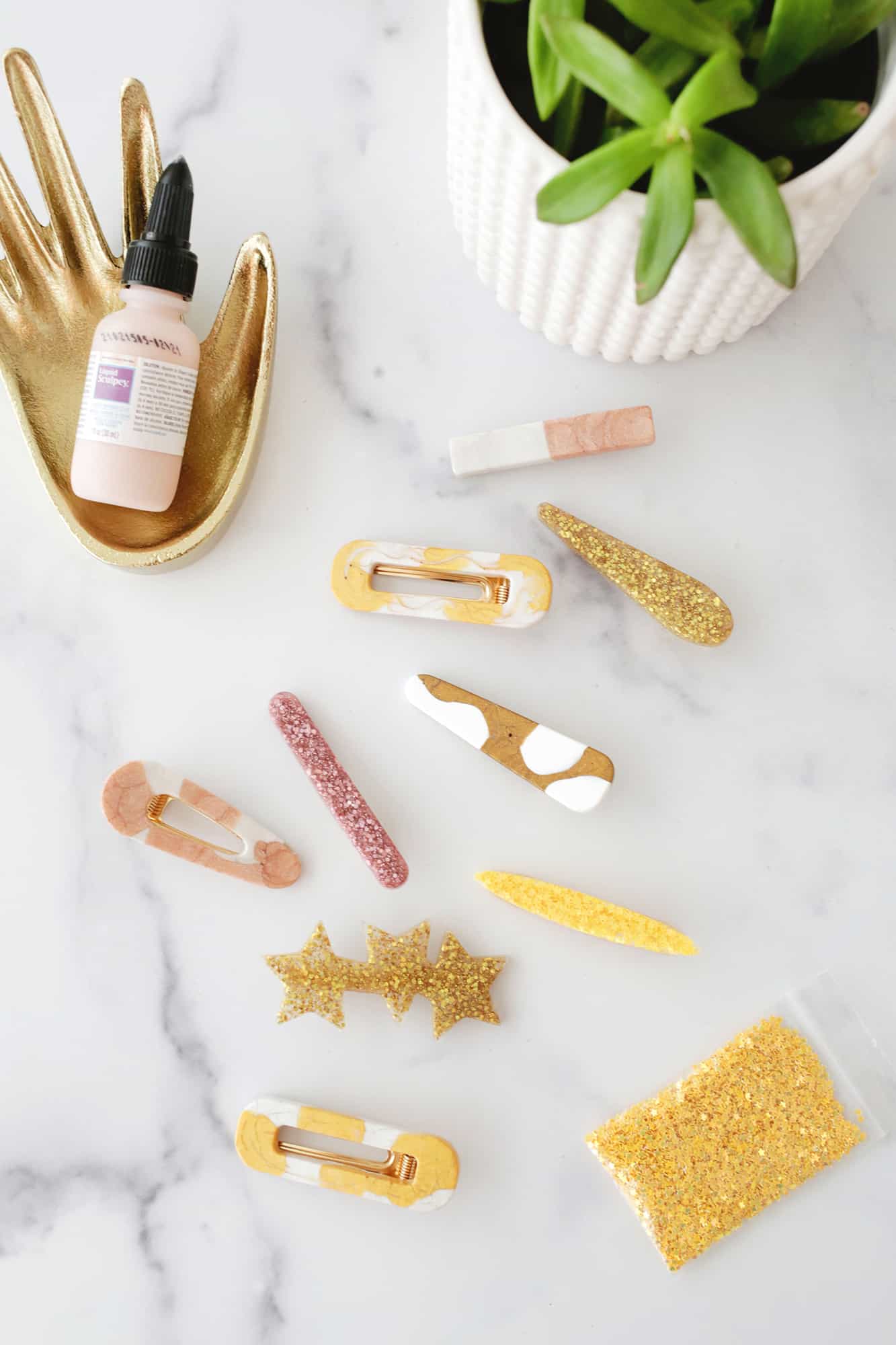 various barrettes laying on marble table